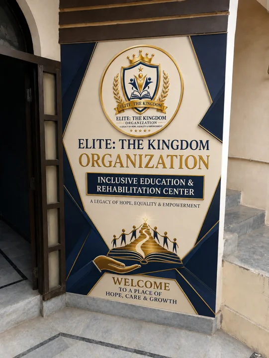 Navy-gold geometric welcome wall — Current Facility